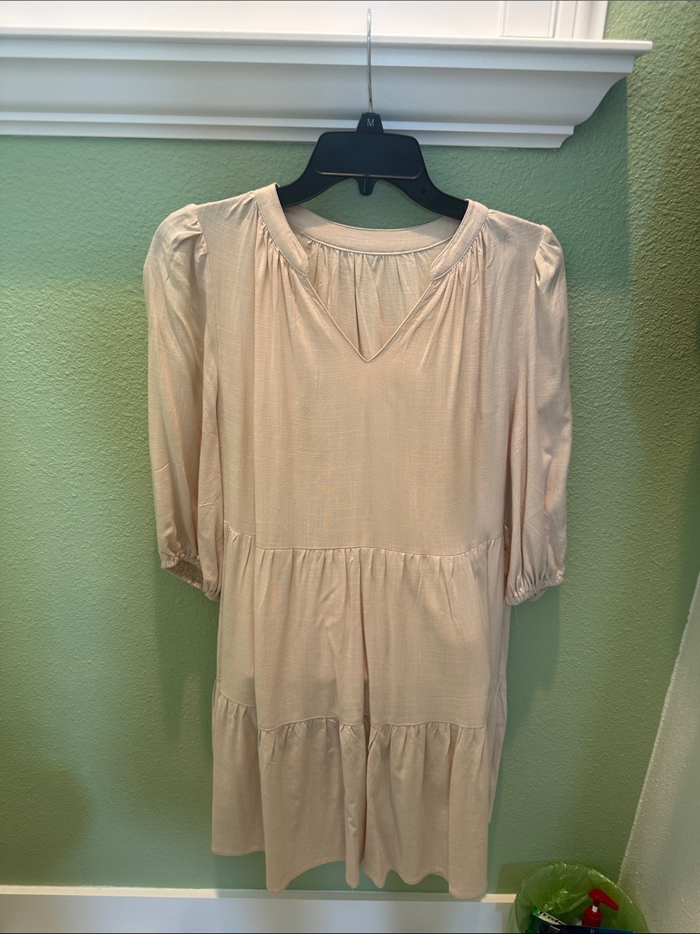 Beige dress, rayon fabric, elastic band on 3/4 arm length sleeves. V neck.